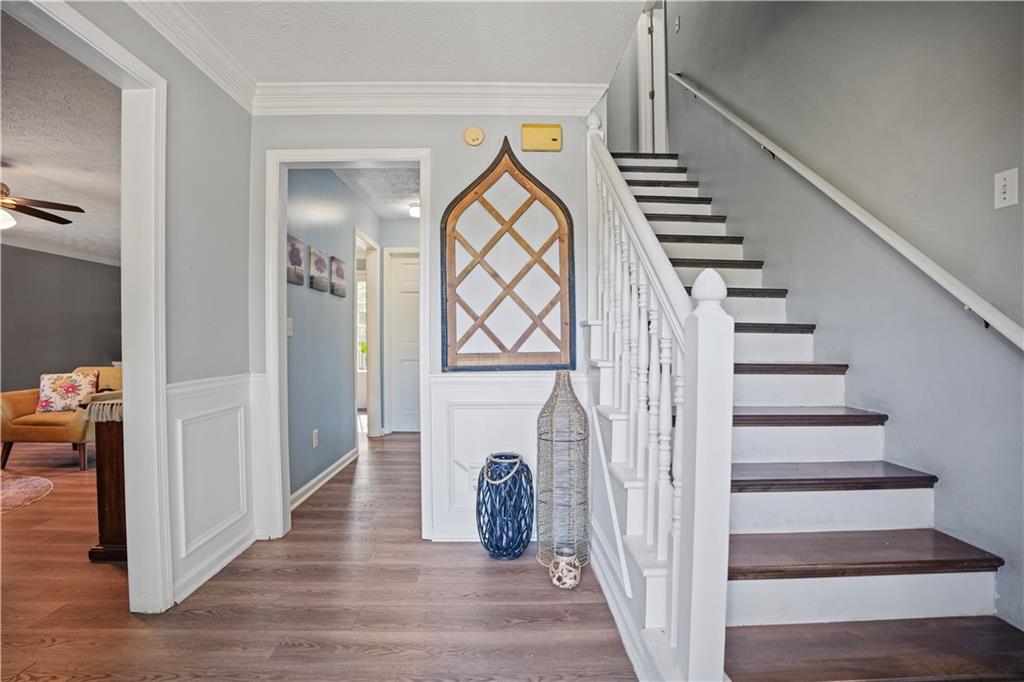 4880 Racquet Court Duluth, GA 30096 - Photo 7 of 22 a view of entryway and hall with wooden floor