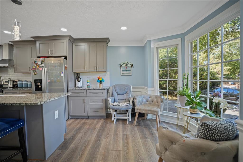4880 Racquet Court Duluth, GA 30096 - Photo 10 of 22 a kitchen with refrigerator and chairs