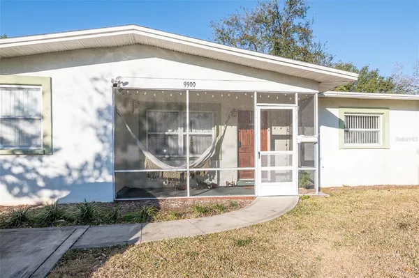 a view of a house with wooden fence