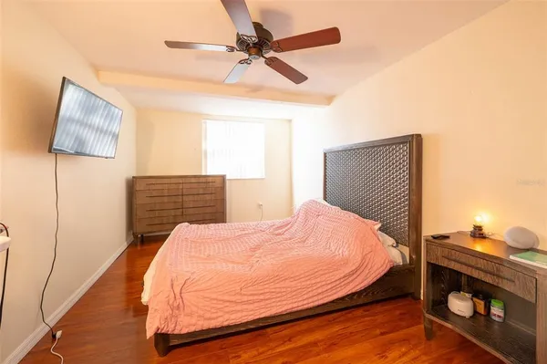 a bedroom with a bed and a dresser