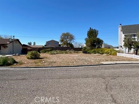 2052 Carty Way Needles, CA 92363 - Photo 2 of 3 a view of a dry yard with wooden fence