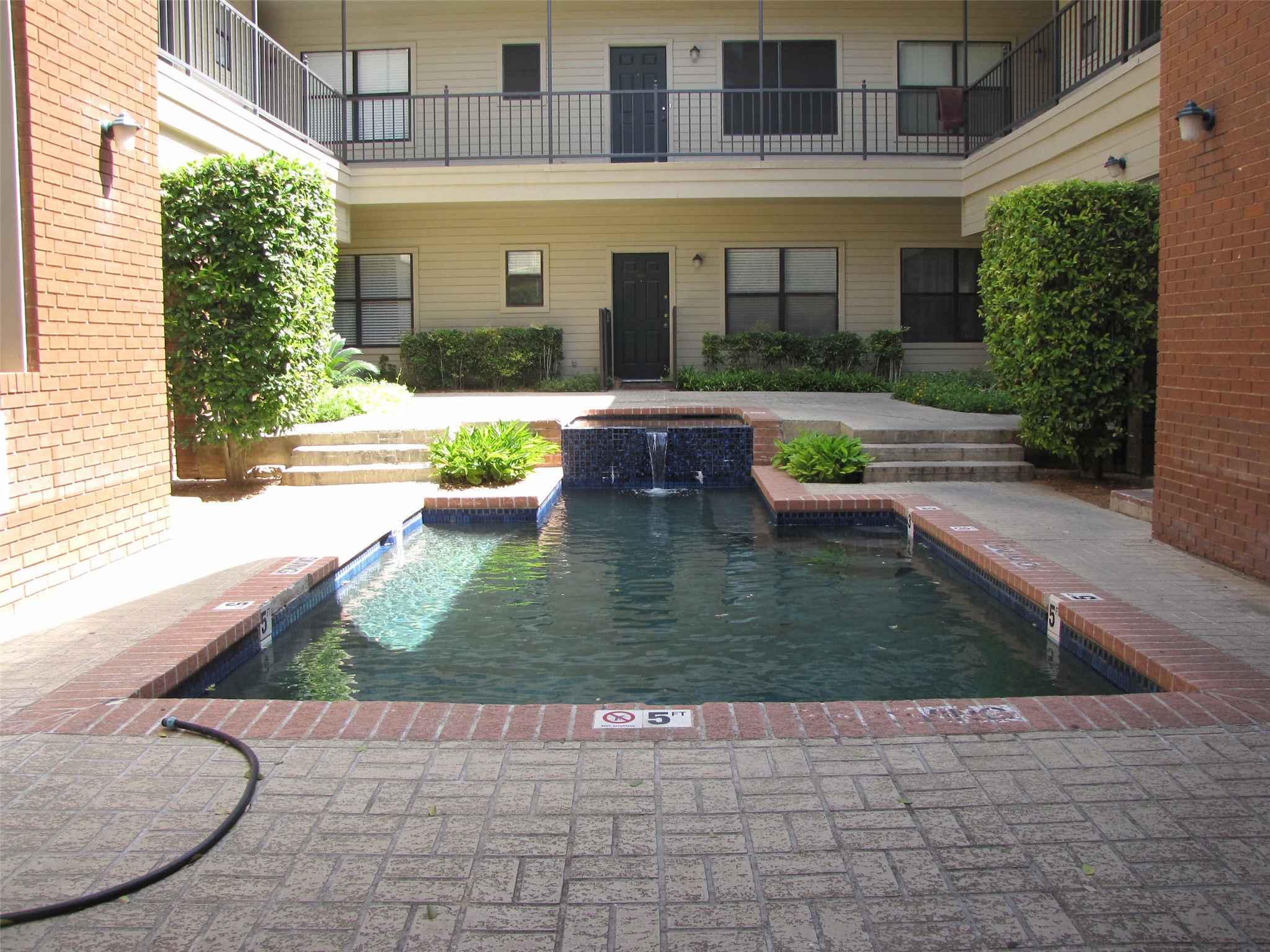 106 East 30th Street, Unit 101 Austin, TX 78705 - Photo 2 of 11 Outdoor pool featuring a patio