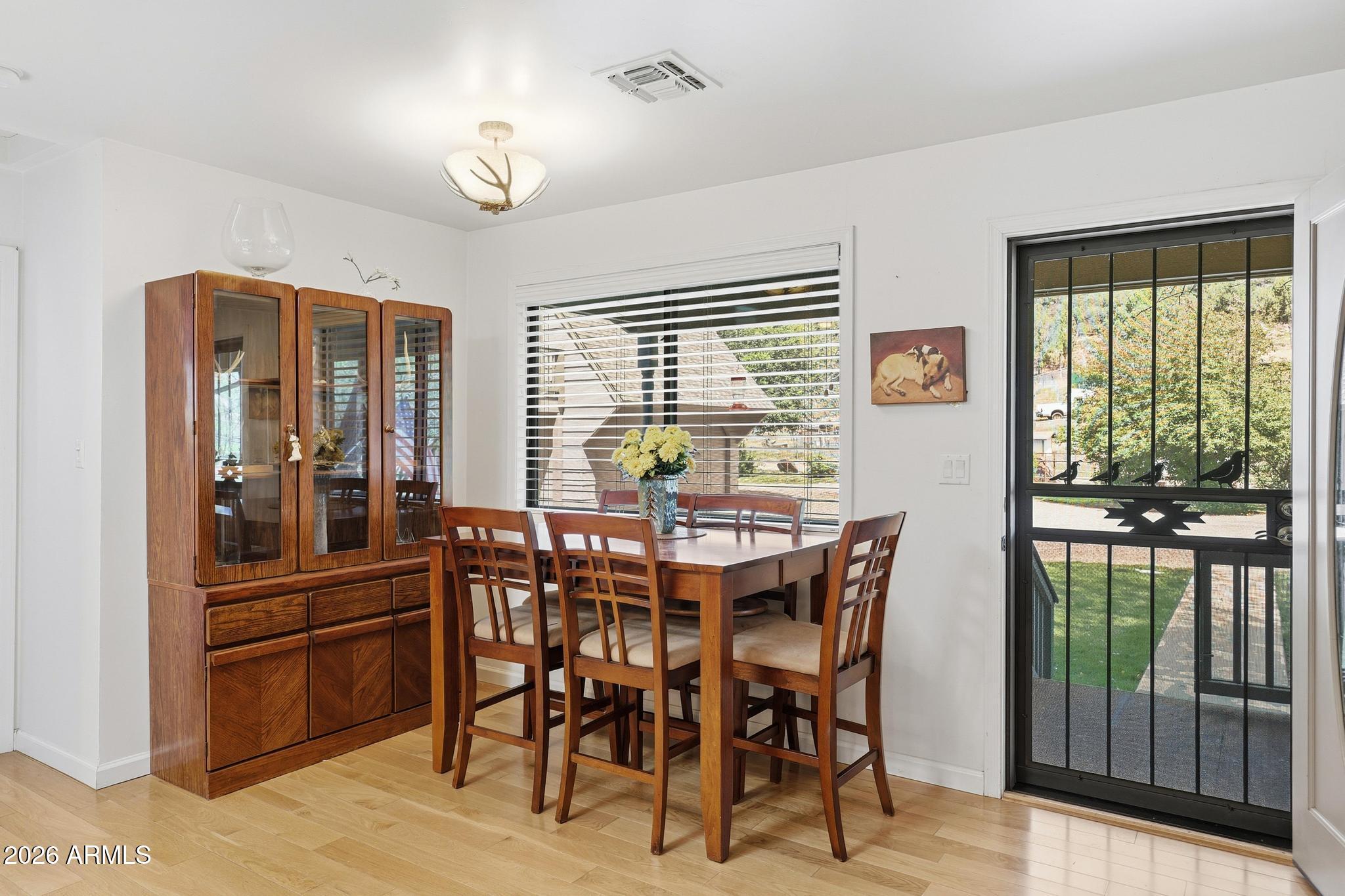 7736 West Gibson Ranch Road Payson, AZ 85541 - Photo 16 of 51 a view of a dining room with furniture window and outside view