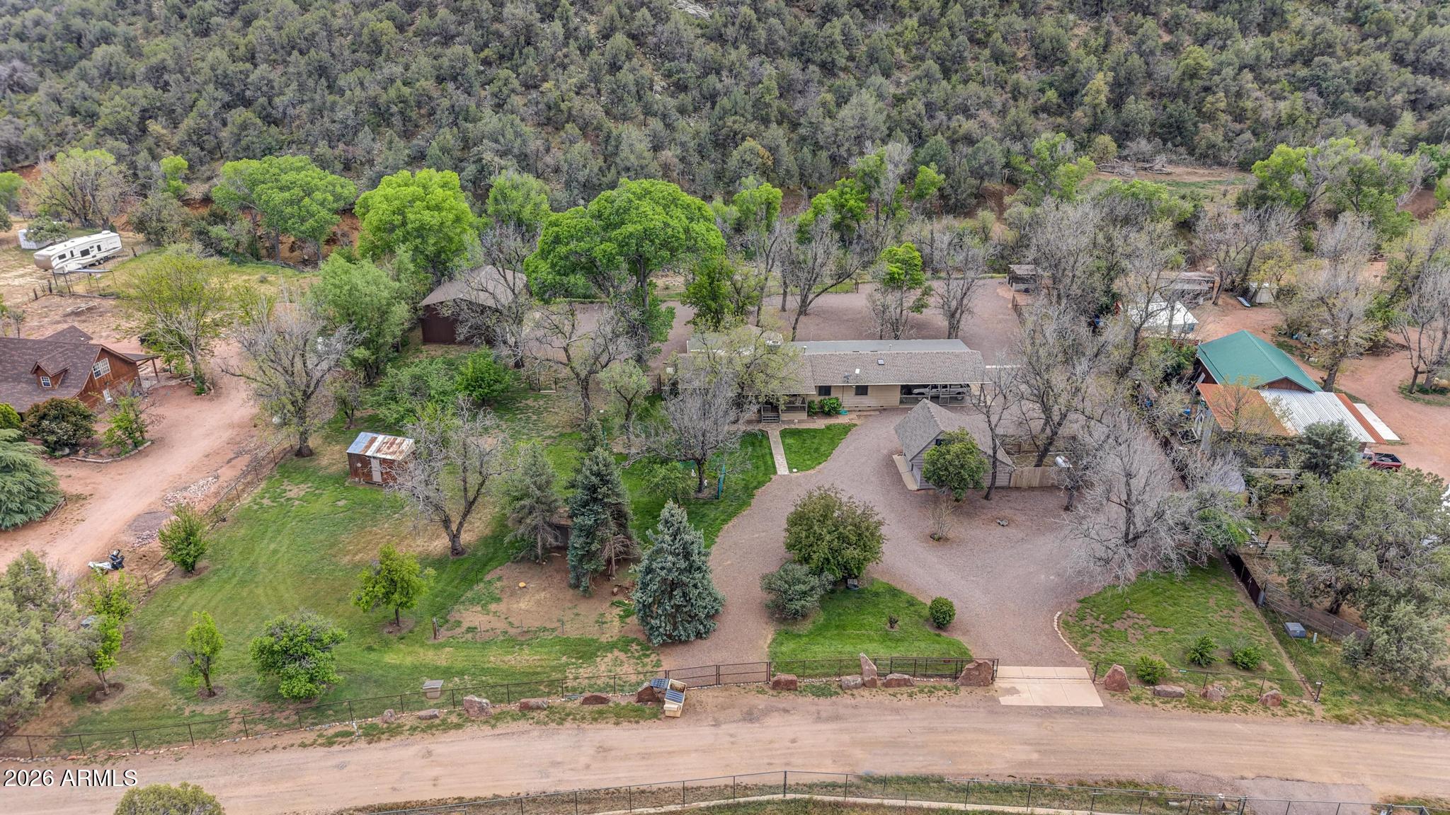 7736 West Gibson Ranch Road Payson, AZ 85541 - Photo 2 of 51 an aerial view of a house with a yard and garden