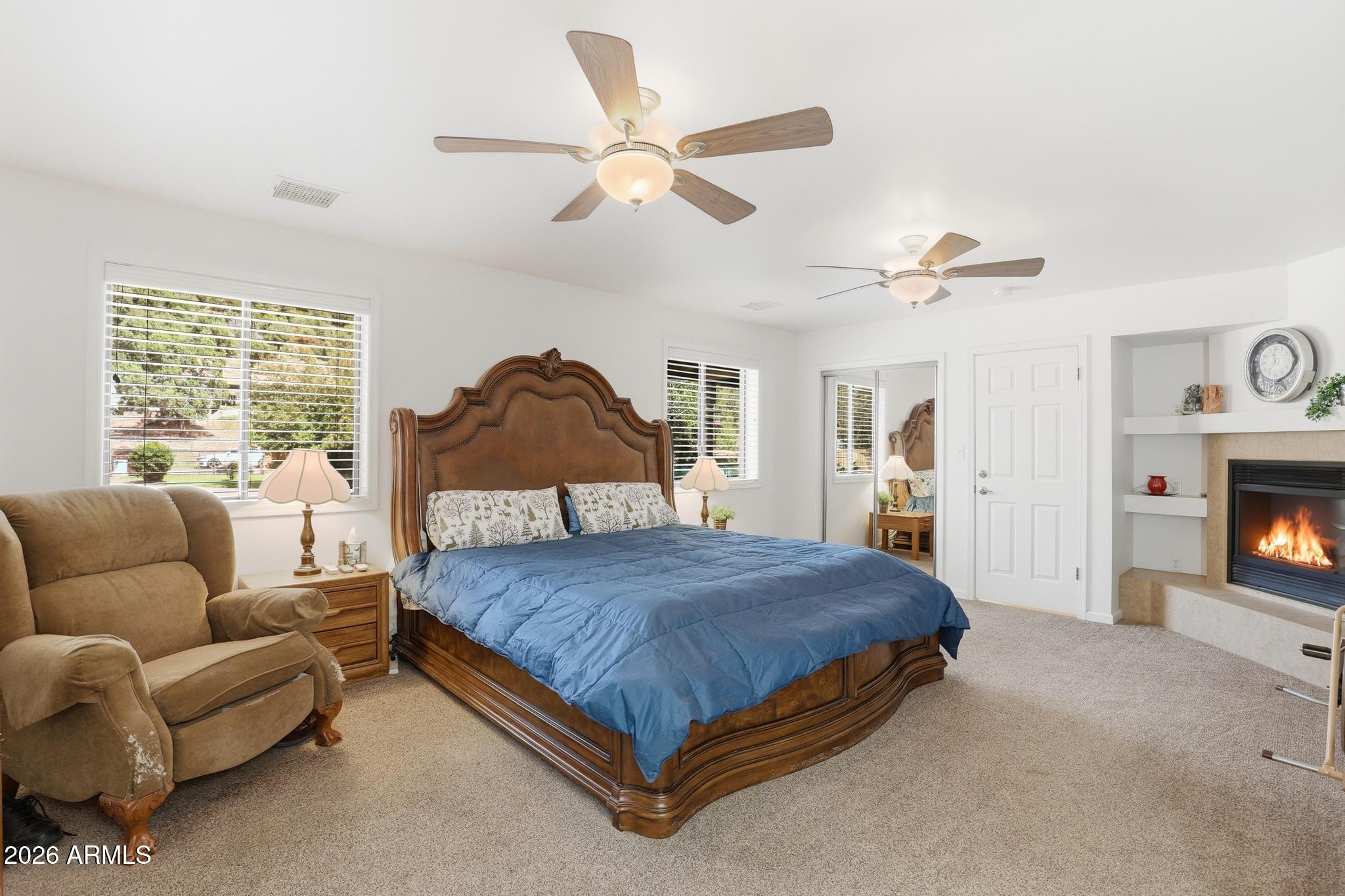 7736 West Gibson Ranch Road Payson, AZ 85541 - Photo 21 of 51 a bedroom with a bed couch and window