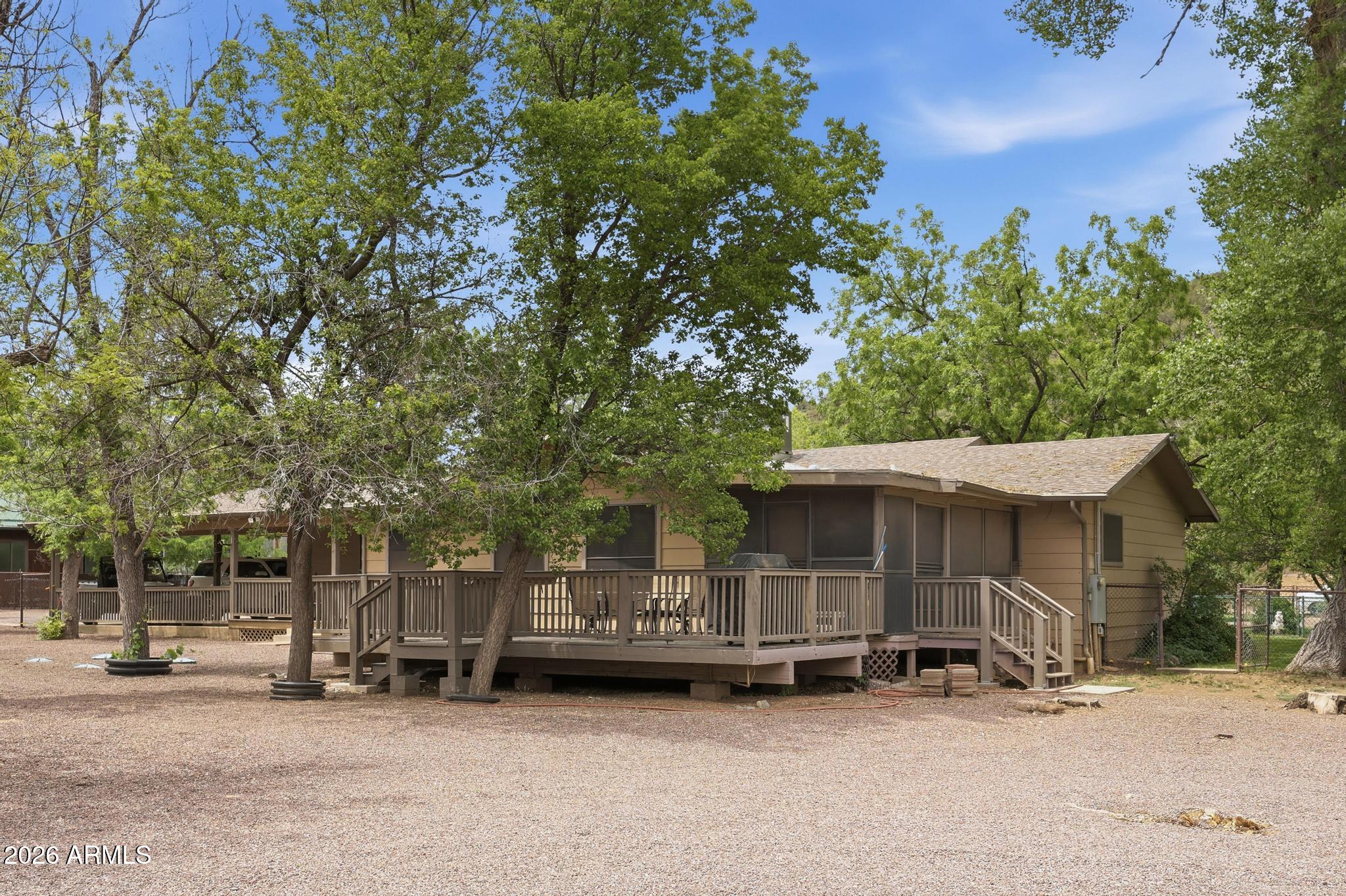 7736 West Gibson Ranch Road Payson, AZ 85541 - Photo 37 of 51 a view of a house with a yard and large trees