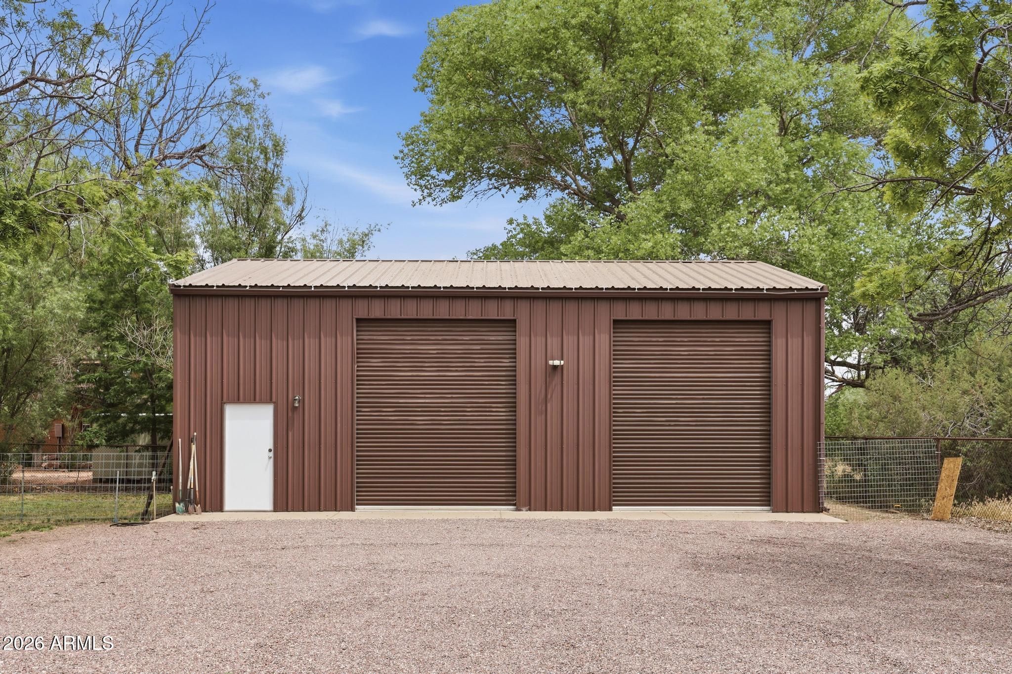 7736 West Gibson Ranch Road Payson, AZ 85541 - Photo 7 of 51 a front view of a house with a yard and garage
