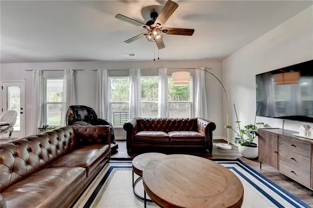 a kitchen with stainless steel appliances white cabinets and a stove top oven