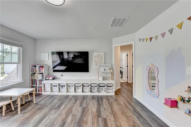 a spacious bathroom with a double vanity sink mirror and shower
