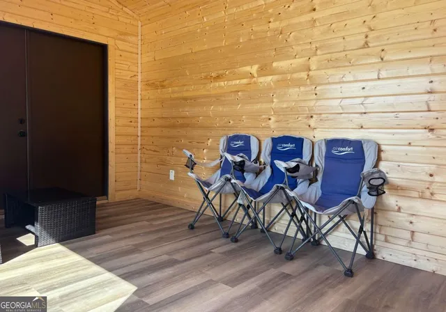 a view of a wooden table and chairs in patio