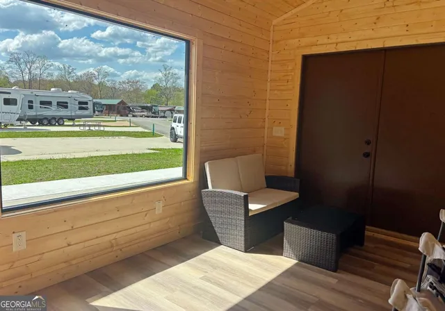 a view of a balcony with chair and table