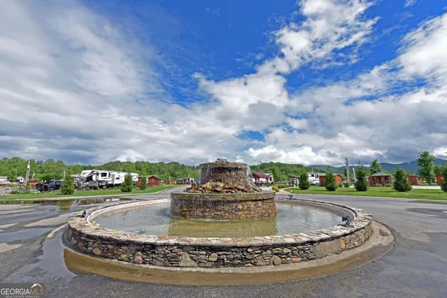 a view of a water fountain in front of the house