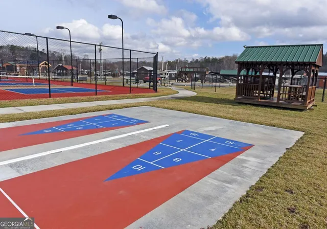 a terrace with outdoor seating and city view