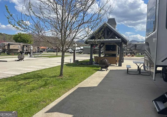 a view of a park with sitting area
