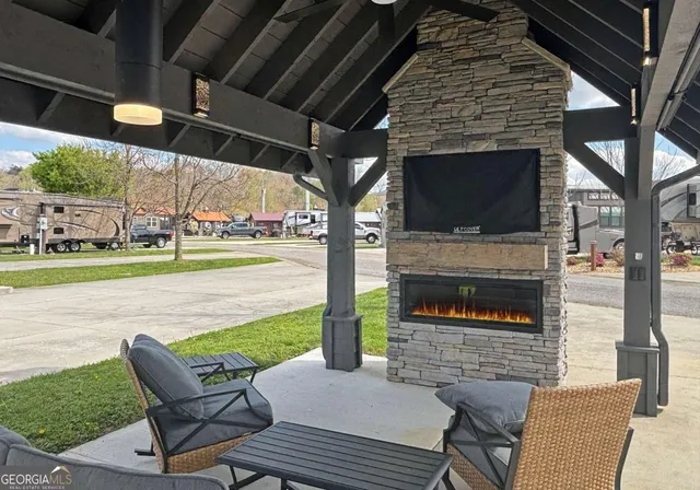 a view of a patio with a table and chairs