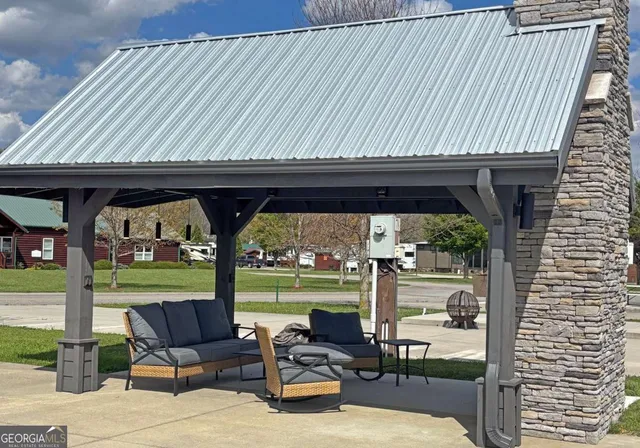 a patio with table and chairs