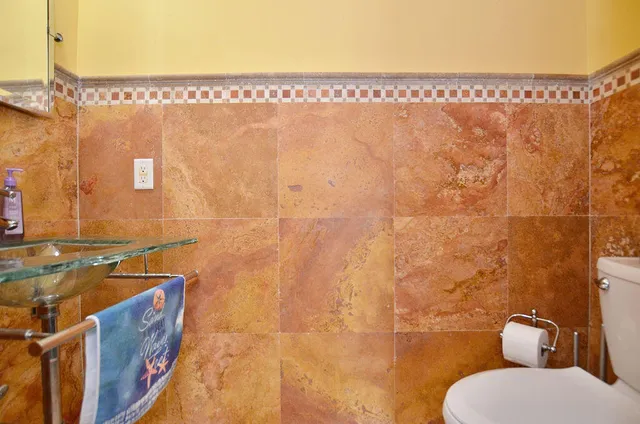 a bedroom with a bed dresser and a window