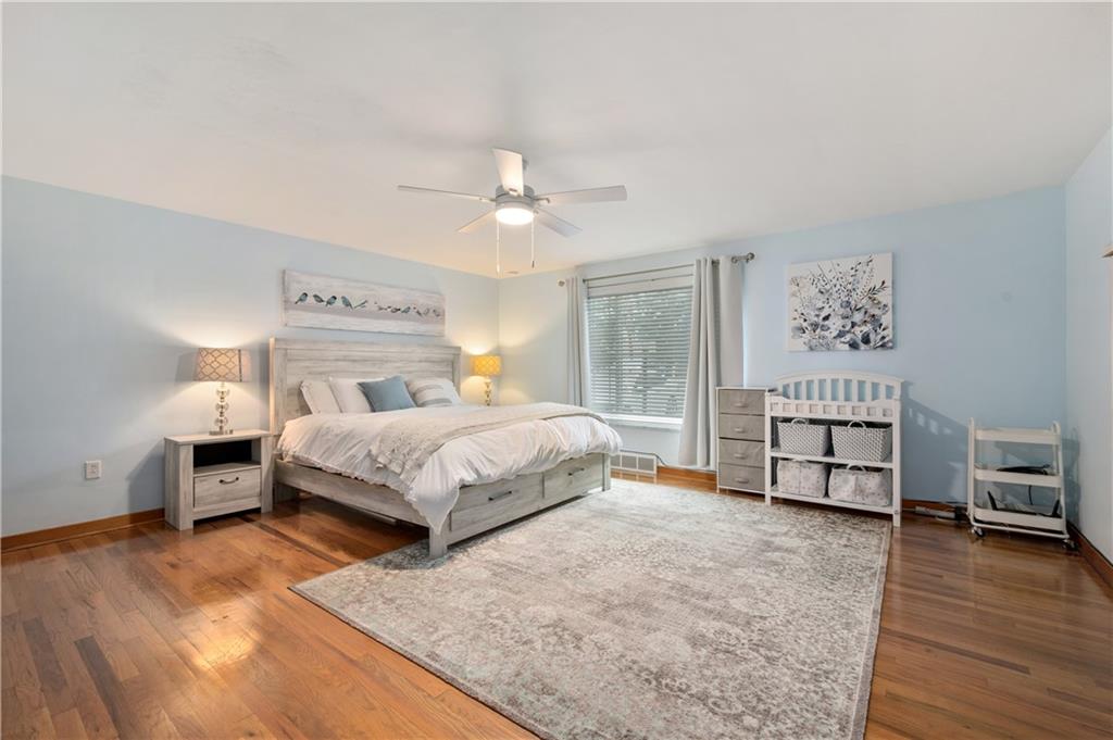 30 Beaver Grade Road McKees Rocks, PA 15136 - Photo 11 of 26 a bedroom with a bed and a chandelier