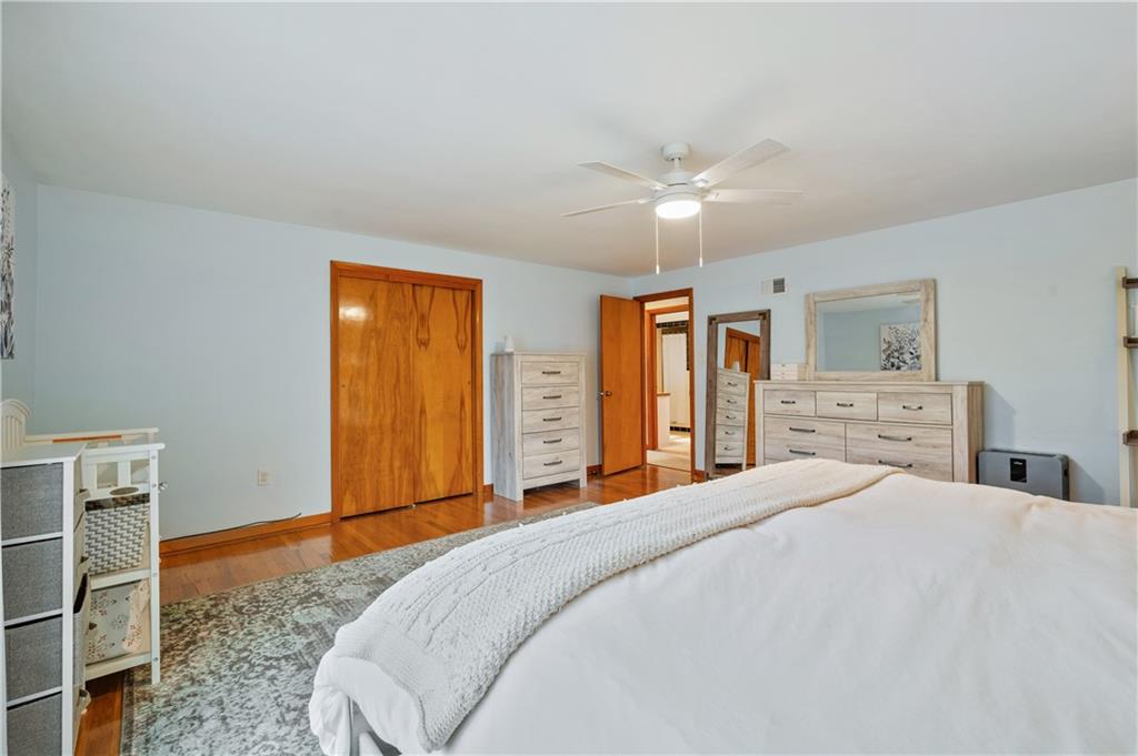 30 Beaver Grade Road McKees Rocks, PA 15136 - Photo 12 of 26 a bedroom with a large bed and a chandelier