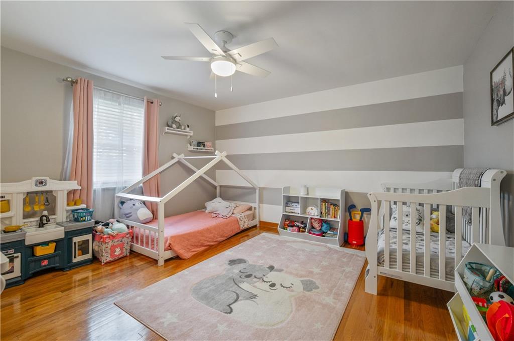 30 Beaver Grade Road McKees Rocks, PA 15136 - Photo 13 of 26 a bedroom with furniture and a wooden floor