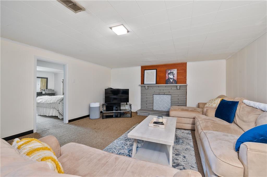 30 Beaver Grade Road McKees Rocks, PA 15136 - Photo 17 of 26 a living room with furniture and a flat screen tv