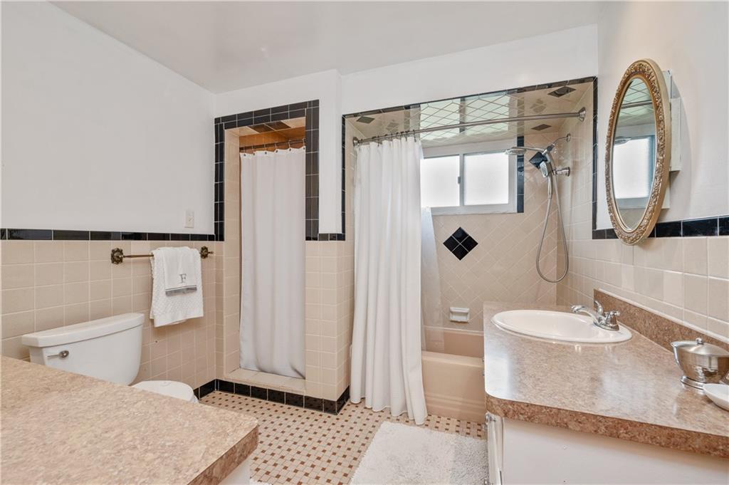 30 Beaver Grade Road McKees Rocks, PA 15136 - Photo 19 of 26 a bathroom with a sink a toilet and shower