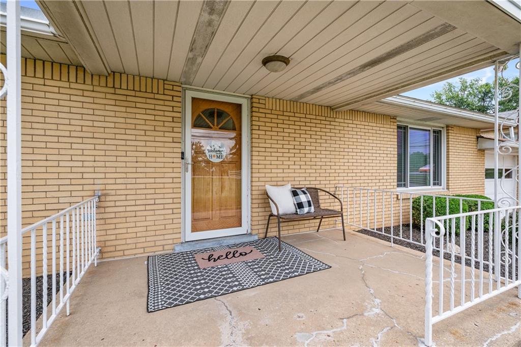 30 Beaver Grade Road McKees Rocks, PA 15136 - Photo 2 of 26 a view of a patio with a table and chairs and wooden floor