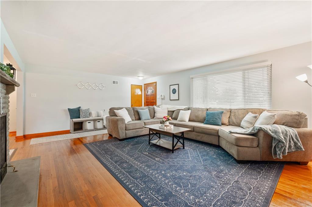 30 Beaver Grade Road McKees Rocks, PA 15136 - Photo 3 of 26 a living room with furniture wooden floor and a fireplace