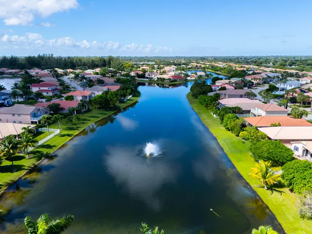 a view of sign board with flower garden