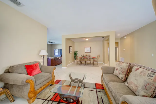 a living room with furniture and a couch
