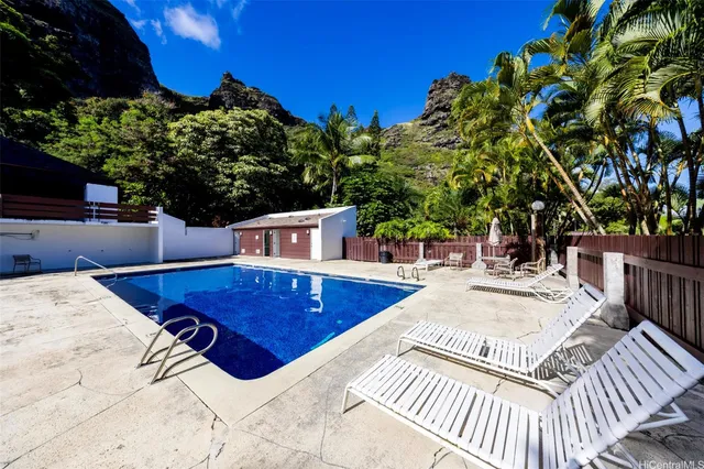 a view of a swimming pool with a patio