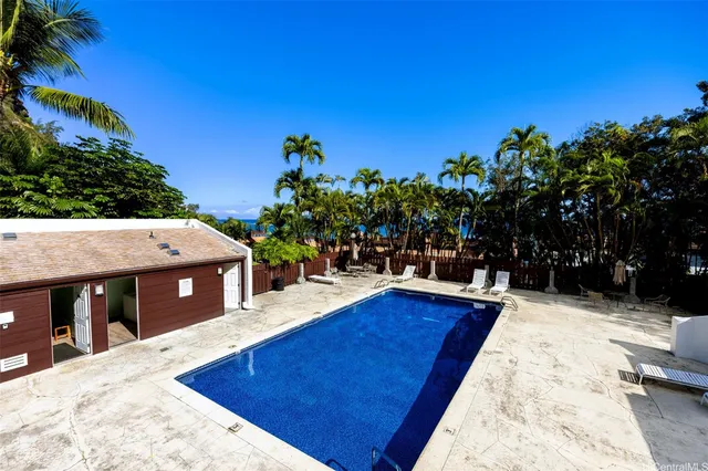 a view of a swimming pool with a patio