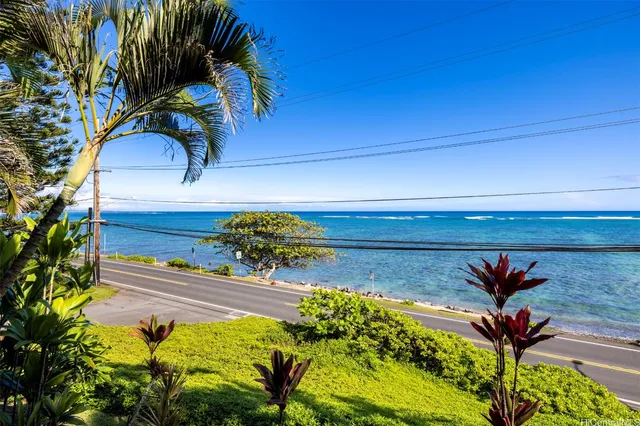 a vase of flowers sitting on a floor