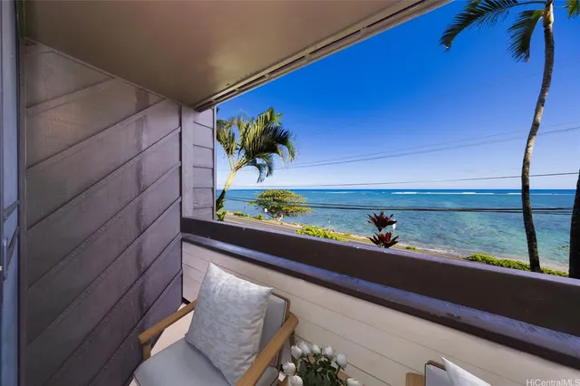 a view of balcony with two chairs