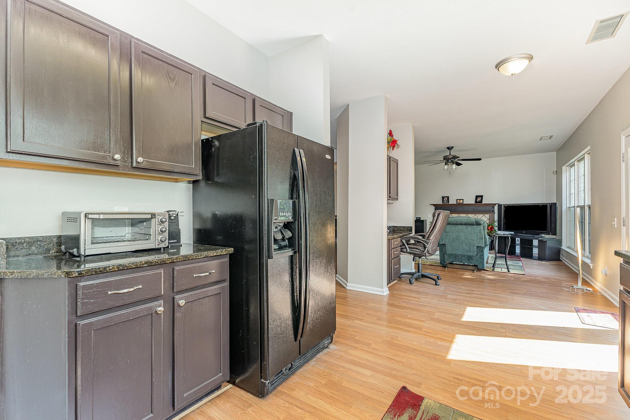 815 Clearbrook Road Matthews, NC 28105 - Photo 11 of 45 a kitchen with stainless steel appliances granite countertop a refrigerator a stove and a sink