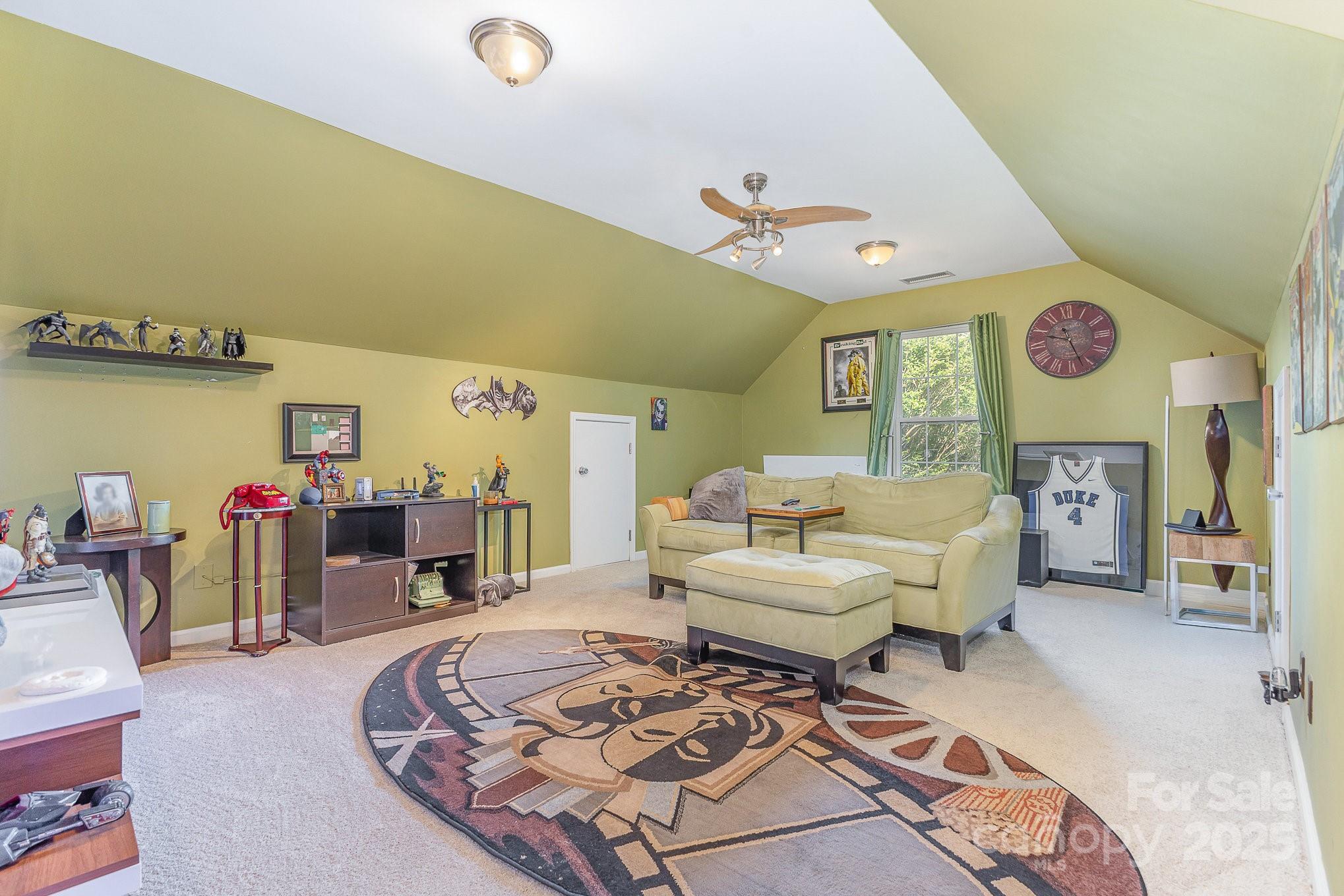 815 Clearbrook Road Matthews, NC 28105 - Photo 26 of 45 a living room with furniture and a wooden floor