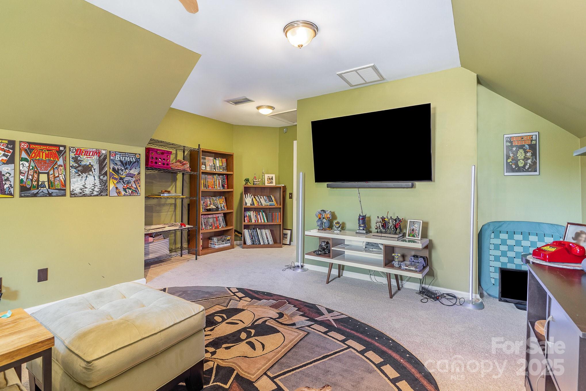 815 Clearbrook Road Matthews, NC 28105 - Photo 28 of 45 a living room with furniture and a flat screen tv
