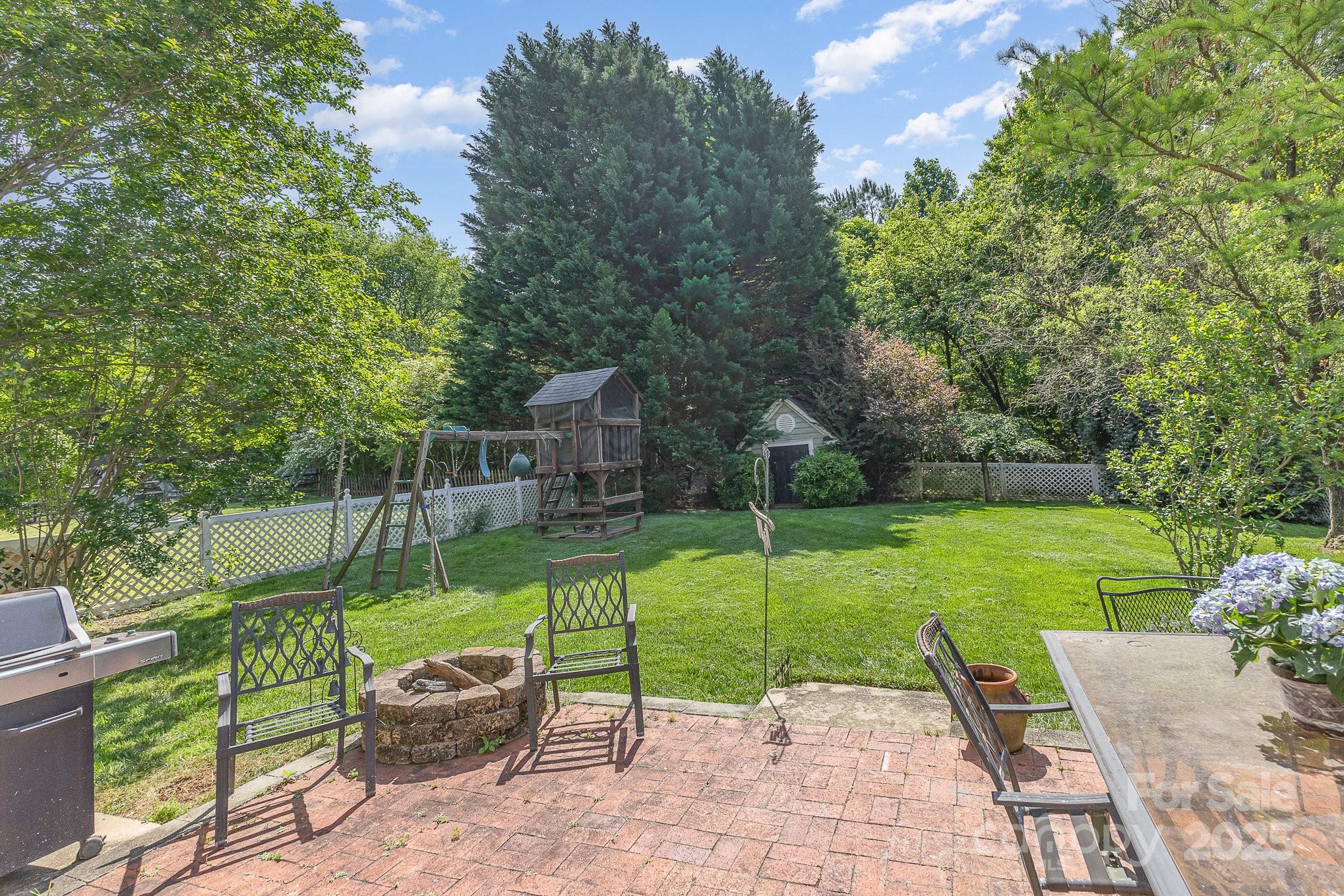 815 Clearbrook Road Matthews, NC 28105 - Photo 33 of 45 a view of a patio with garden