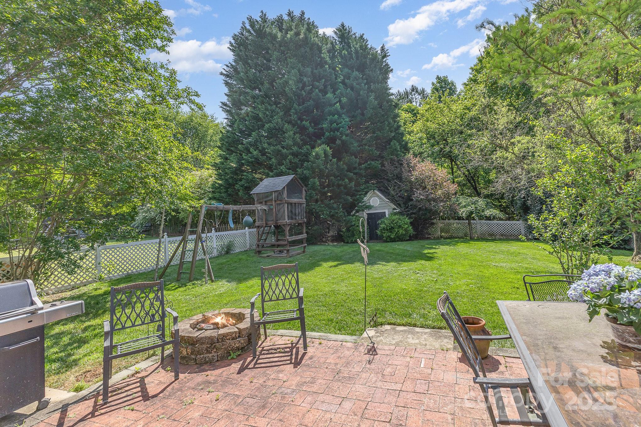 815 Clearbrook Road Matthews, NC 28105 - Photo 34 of 45 a view of a park with plants and large trees