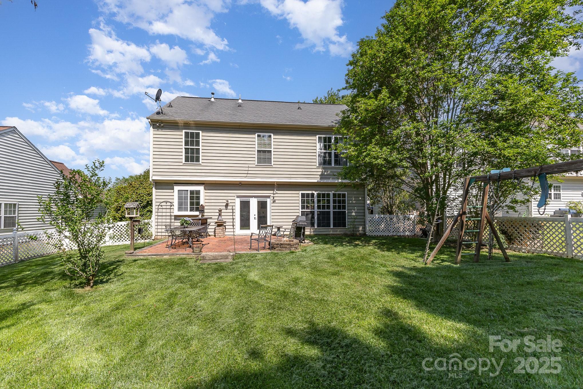 815 Clearbrook Road Matthews, NC 28105 - Photo 38 of 45 a view of a house with a yard porch and sitting area