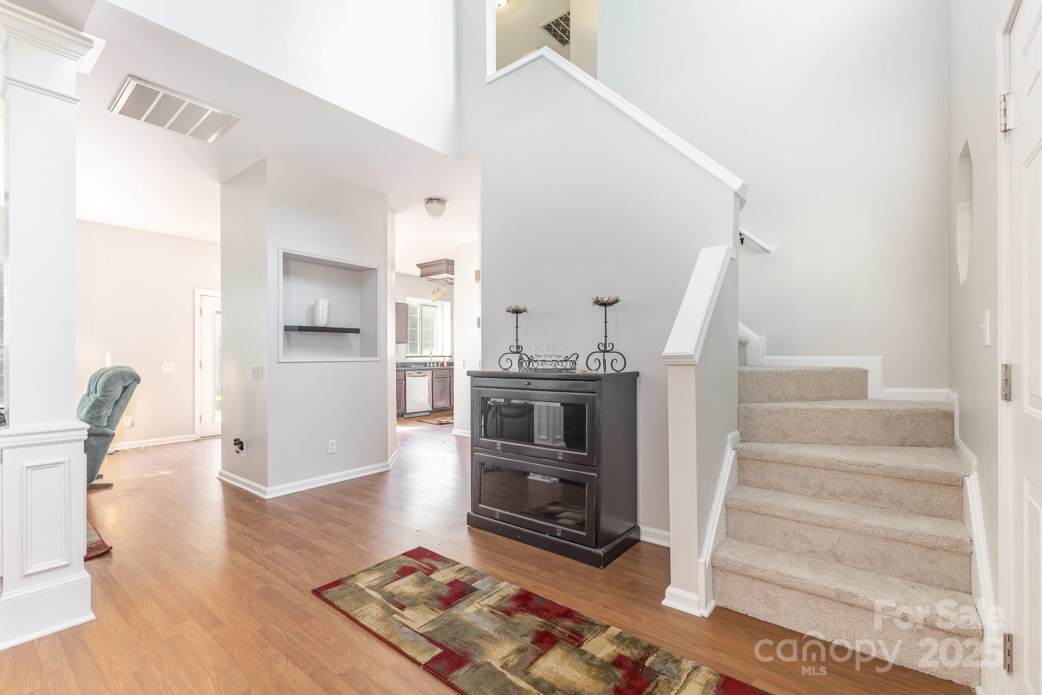 815 Clearbrook Road Matthews, NC 28105 - Photo 4 of 45 a living room with furniture and a wooden floor