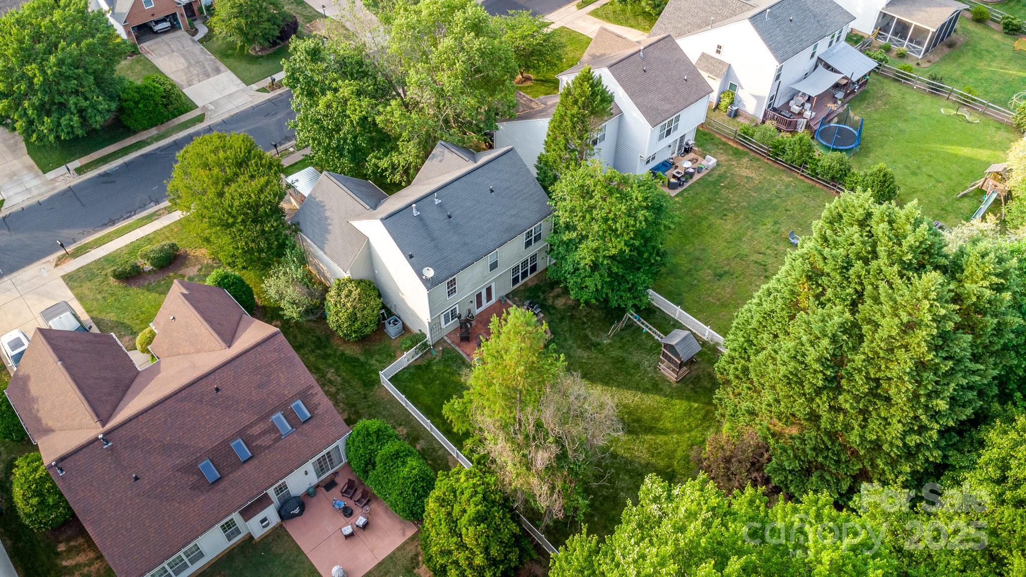 815 Clearbrook Road Matthews, NC 28105 - Photo 42 of 45 an aerial view of a house with a garden