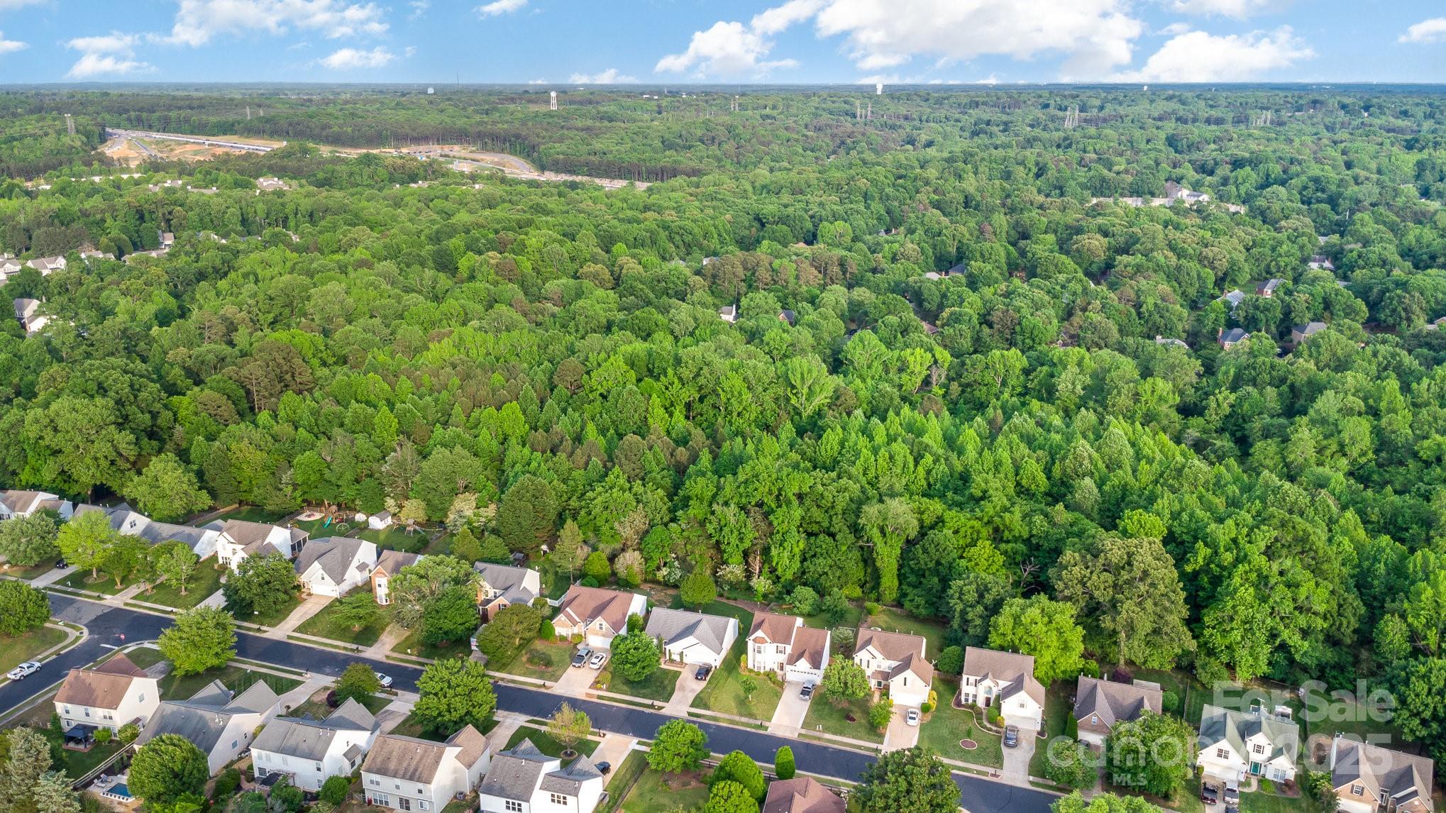 815 Clearbrook Road Matthews, NC 28105 - Photo 44 of 45 a view of a field of grass and an outdoor space