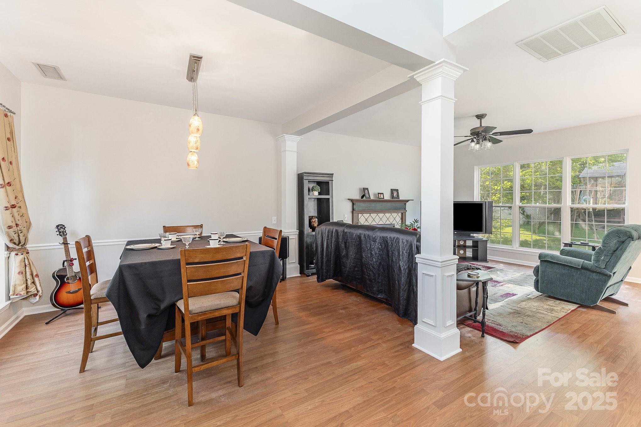 815 Clearbrook Road Matthews, NC 28105 - Photo 5 of 45 a view of a workspace with furniture and a livingroom