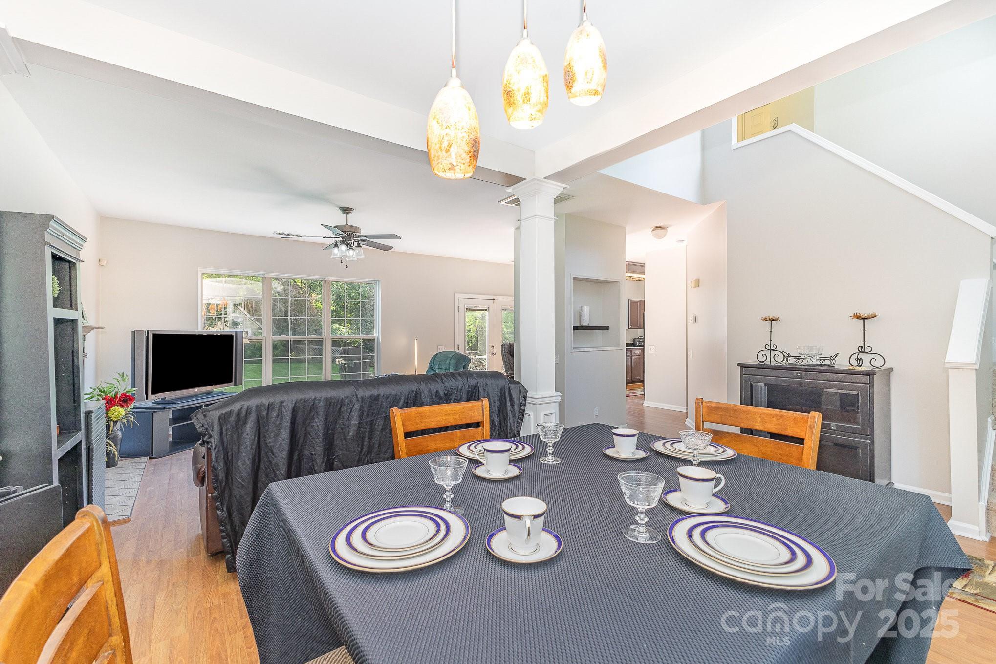 815 Clearbrook Road Matthews, NC 28105 - Photo 8 of 45 a living room with furniture and a flat screen tv