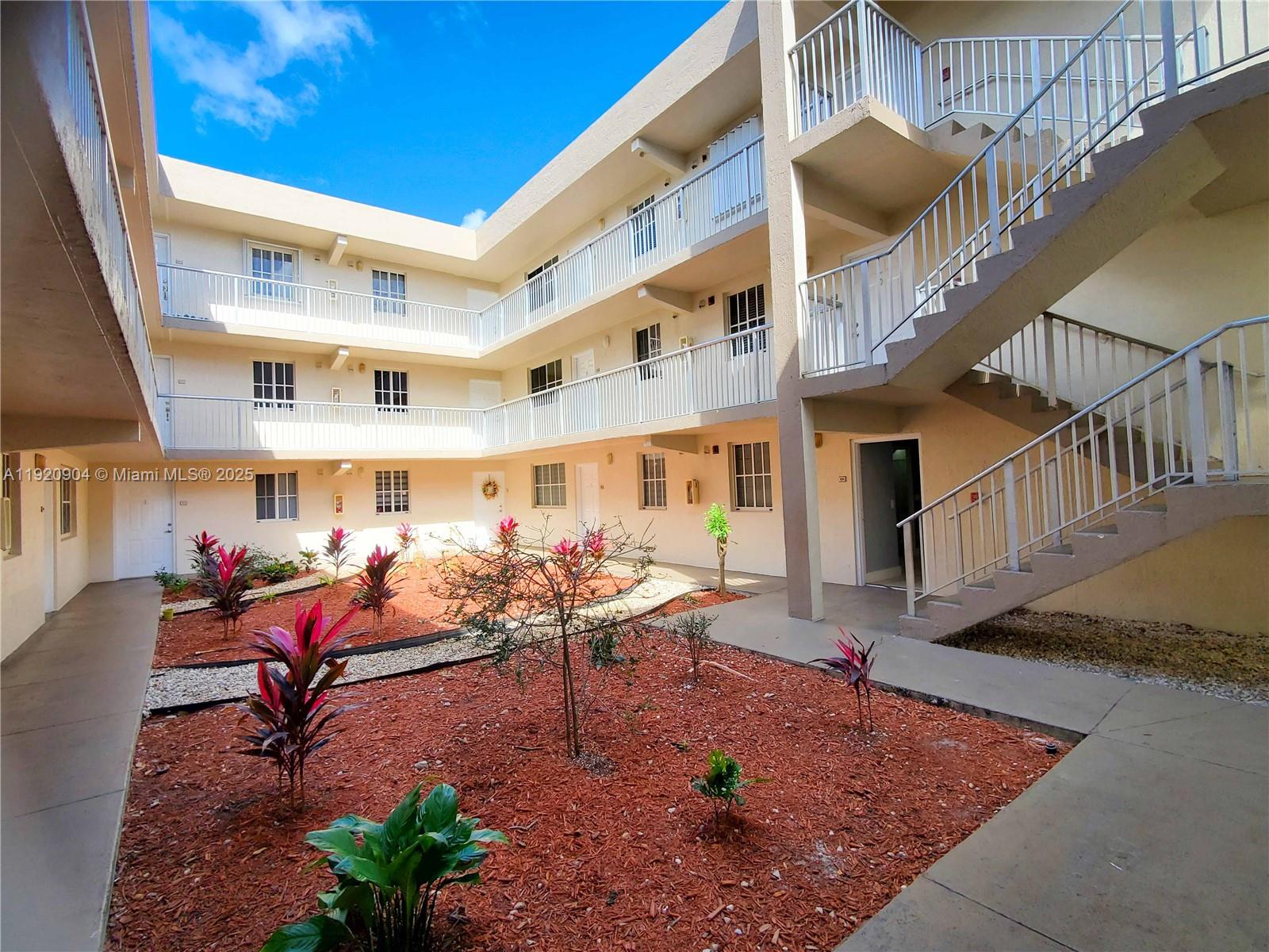 6065 Northwest 186th Street, Unit 106 Hialeah, FL 33015 - Photo 15 of 20 a view of a swimming pool with sitting area