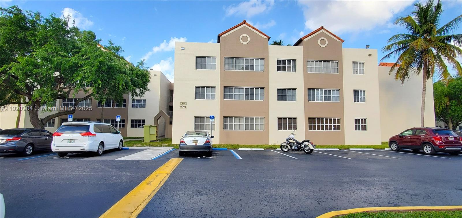 6065 Northwest 186th Street, Unit 106 Hialeah, FL 33015 - Photo 16 of 20 a view of a street with cars
