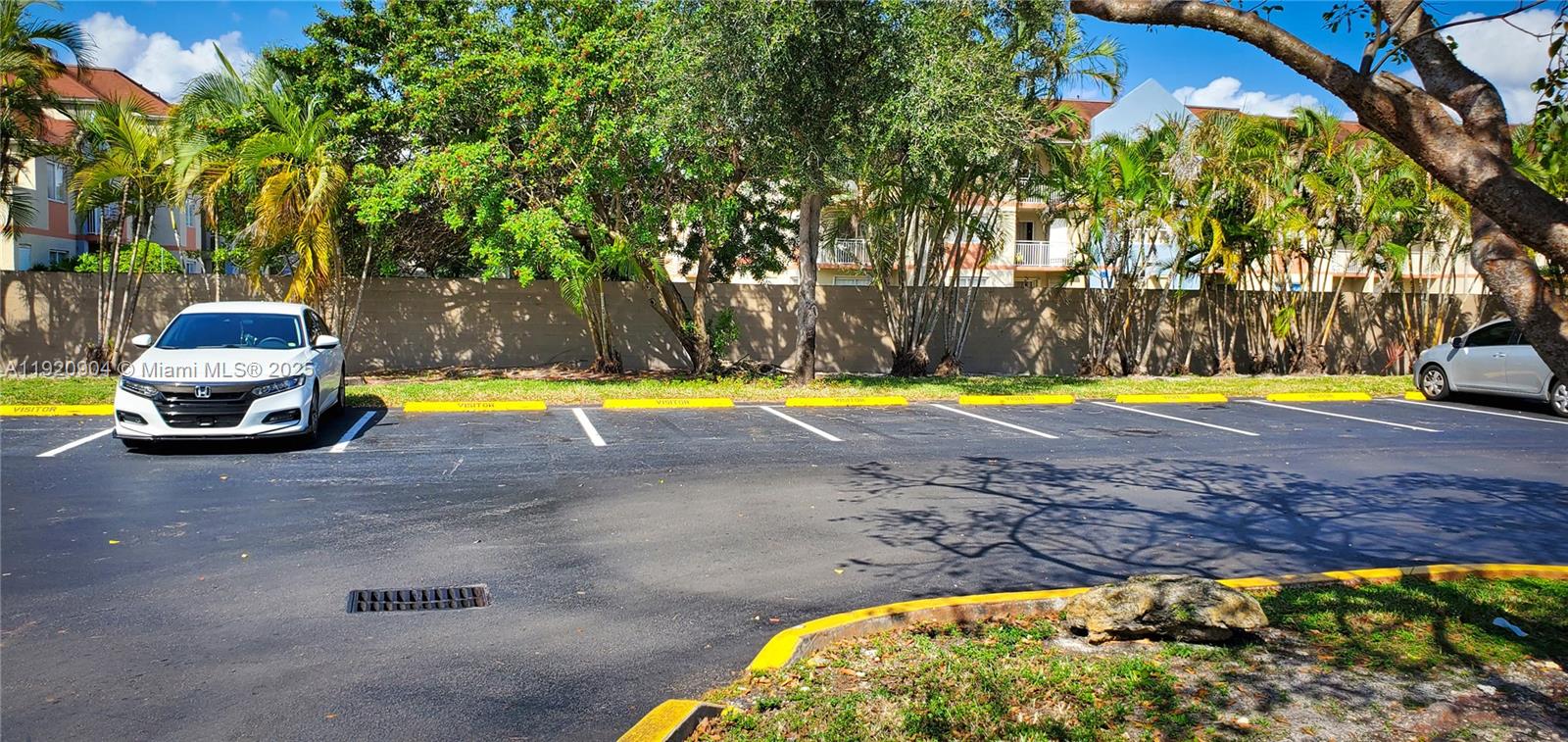 6065 Northwest 186th Street, Unit 106 Hialeah, FL 33015 - Photo 18 of 20 a view of a swimming pool with a patio