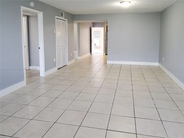 a view of an empty room and window