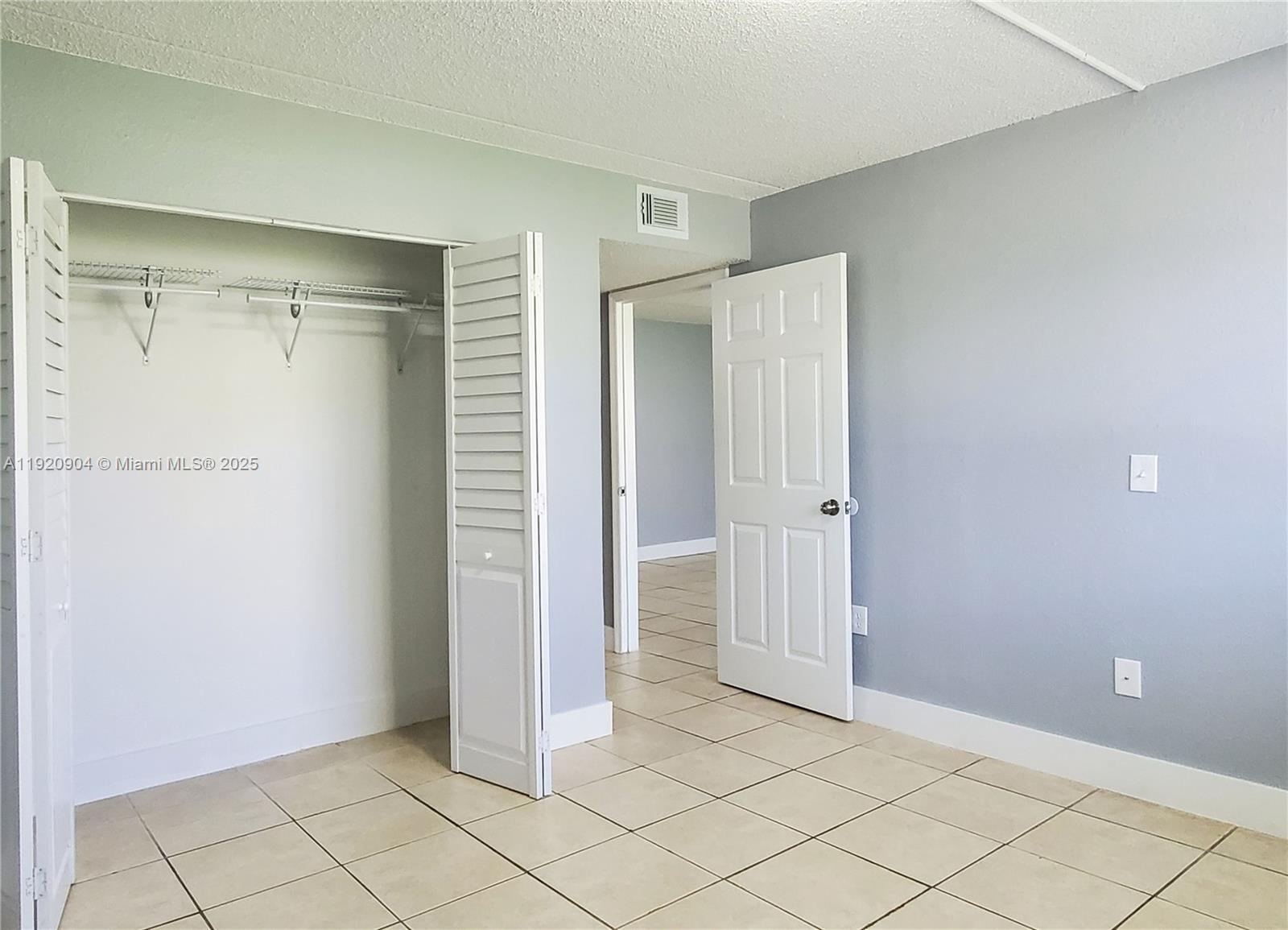 6065 Northwest 186th Street, Unit 106 Hialeah, FL 33015 - Photo 4 of 20 a view of an empty room